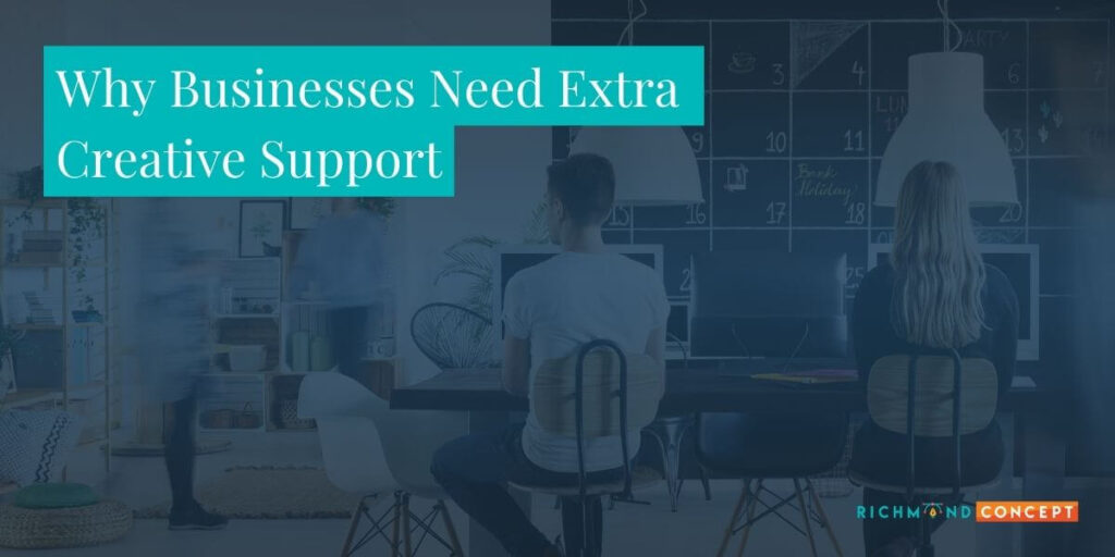 Office team working at a shared table with the headline 'Why Businesses Need Extra Creative Support' displayed in a teal banner, representing Richmond Concept’s creative overflow services.