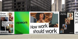 A series of Upwork billboards displayed in an urban setting with tall buildings in the background. The billboards feature diverse professionals working collaboratively. Text on the billboards includes phrases like “Grow teams, not cubicle farms,” “How work should work,” and “Top talent a tap away,” along with the Upwork logo and website URL. The design incorporates bold typography, vibrant green and white backgrounds, and images of people working remotely.